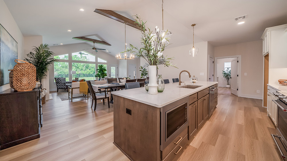 A kitchen island featuring rich wood and stone countertop.