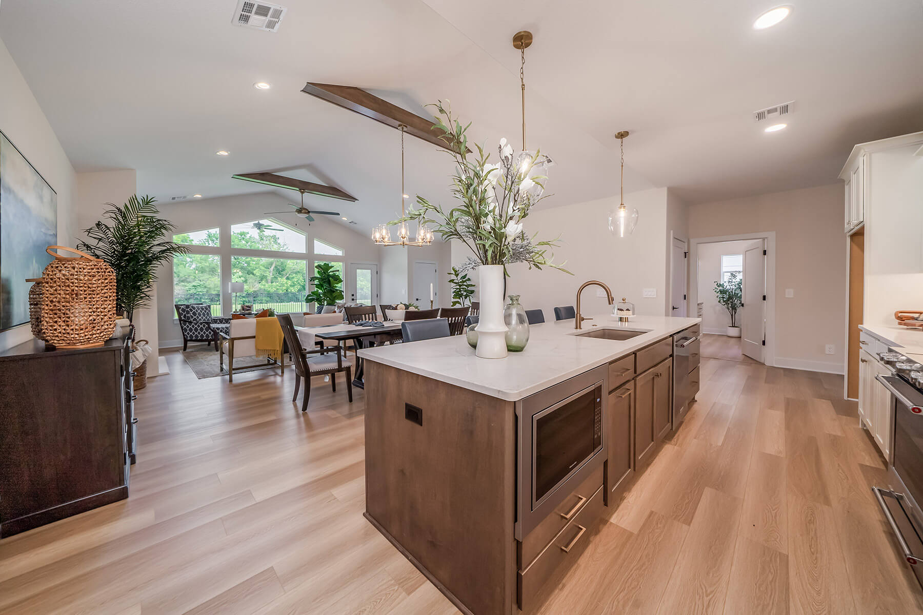 A kitchen island featuring rich wood and stone countertop.